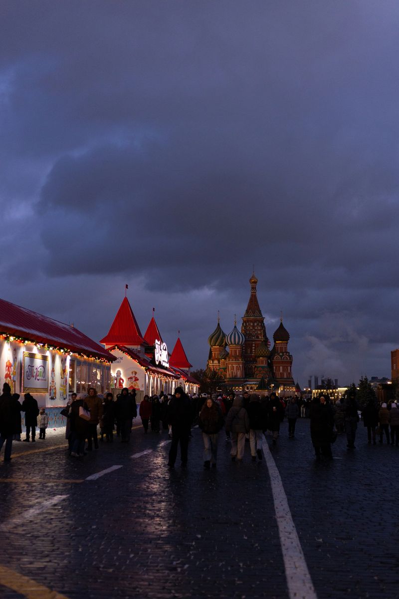 Dusk Crowd Around Iconic Cathedral Domes, Street Performers And Vendors Creating Vibrant Scene, Silhouettes .