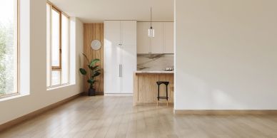 Minimalist kitchen with wood accents and large windows for natural light.