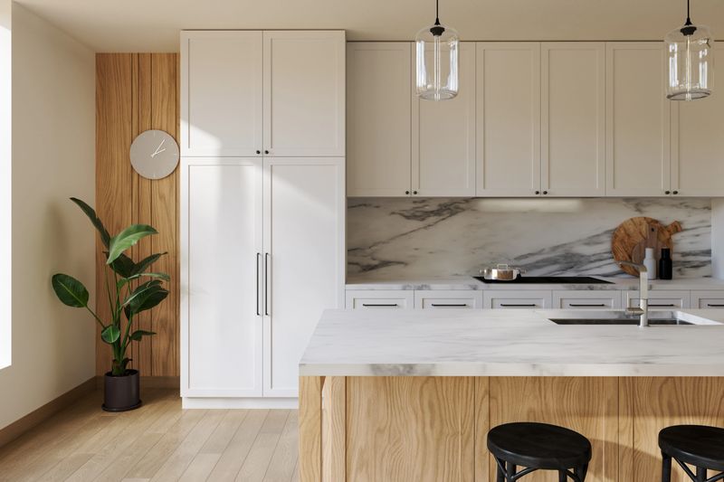 Close-up of empty modern kitchen with white cabinets and marble island, backsplash. Ideal clean background space for product mockups and design detail. 3d Rendering