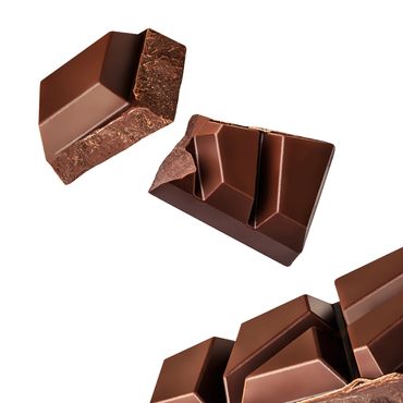 Close-up of broken chocolate pieces with a smooth surface.