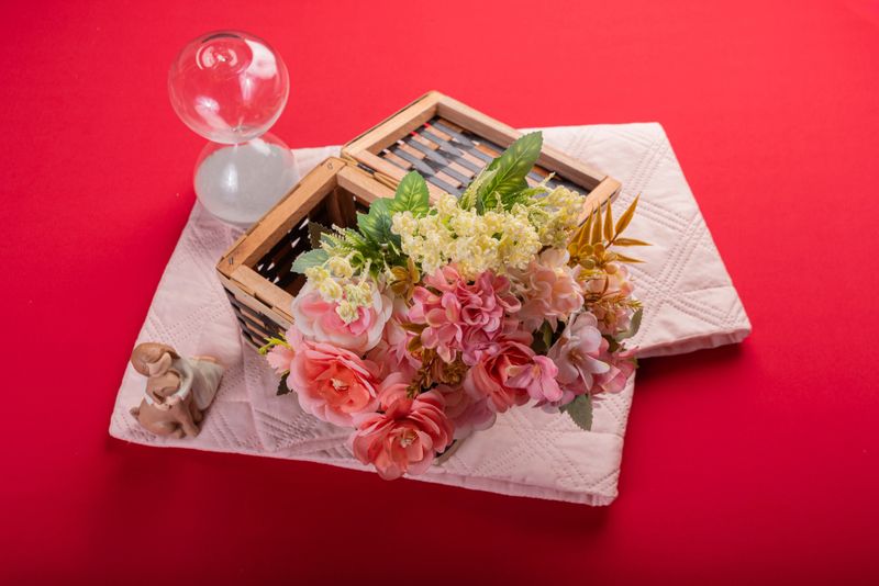 Minimal floral arrangement on red surface