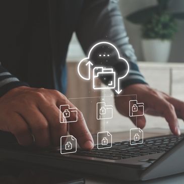 Person interacting with cloud storage on a laptop.