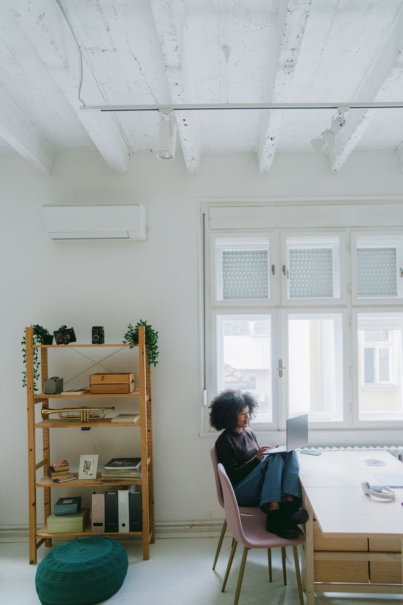 Photo of a young African American woman working from her home office