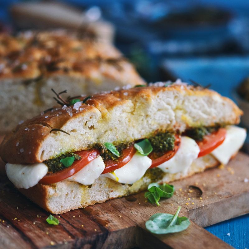 Focaccia Sandwich with Tomatoes, Mozzarella, Pesto and Basil