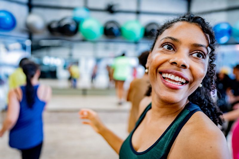 Mid adult woman during dance class at the fitness center