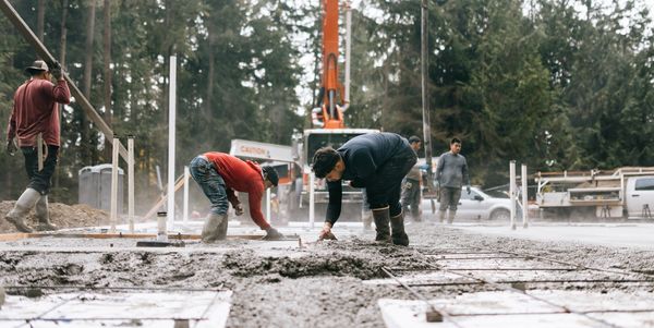 Foundation repair experts working on site
