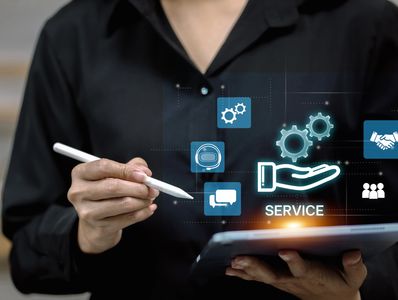 Person using tablet with digital service icons.