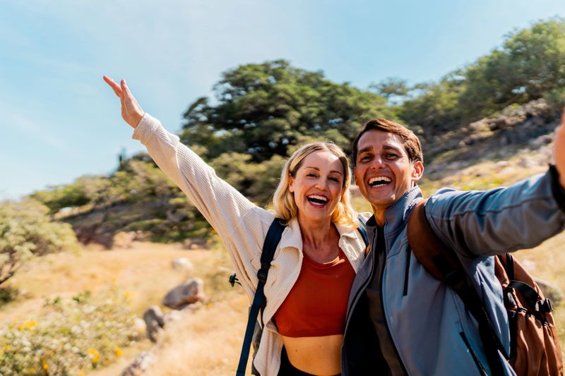 Couple taking a selfie during hike - Camera point of view