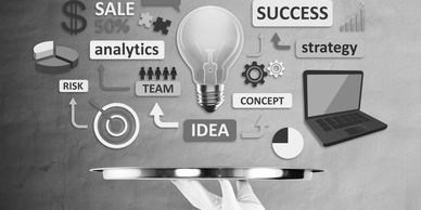 Conceptual image of business ideas and strategy with a light bulb and laptop on a tray.