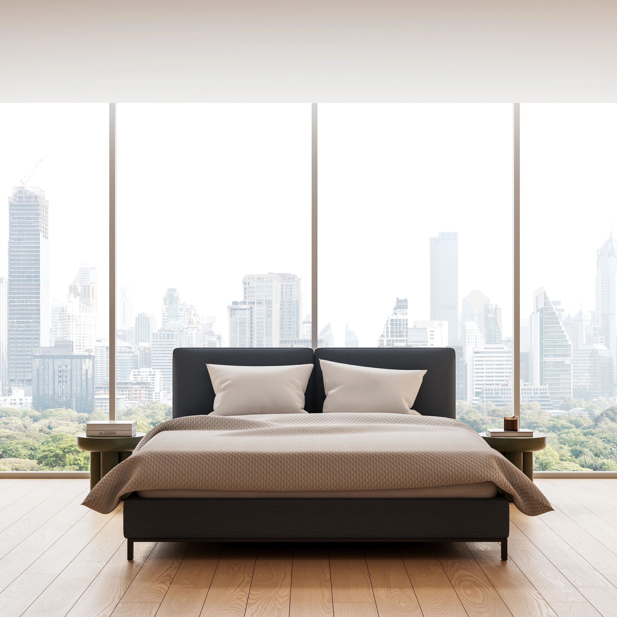 Modern bedroom with a large bed and city skyline view.