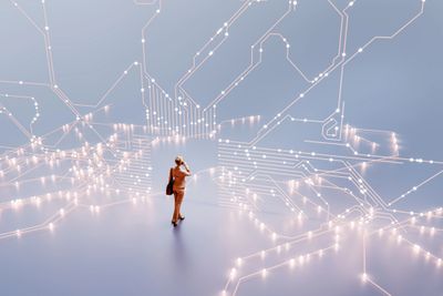 Businesswoman analyzing a glowing digital circuit network.