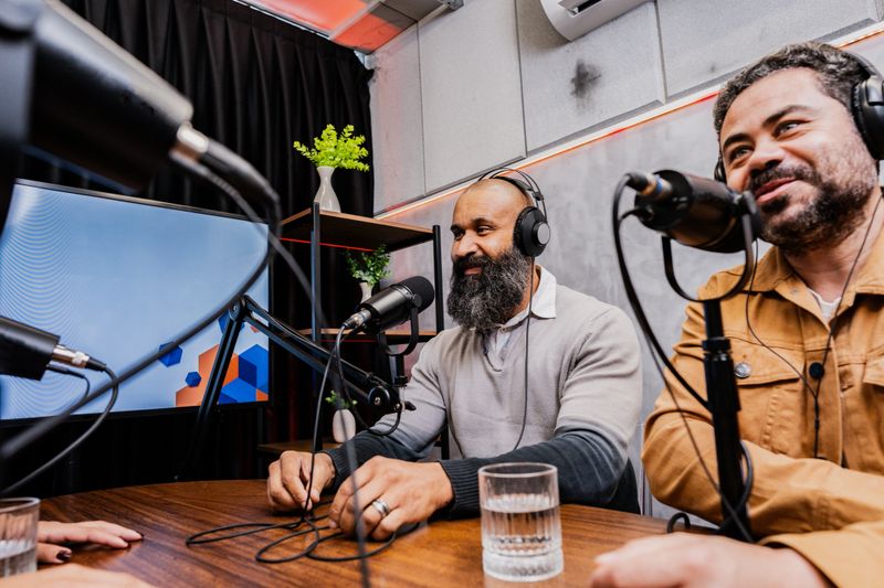 Podcast guests talking on a studio
