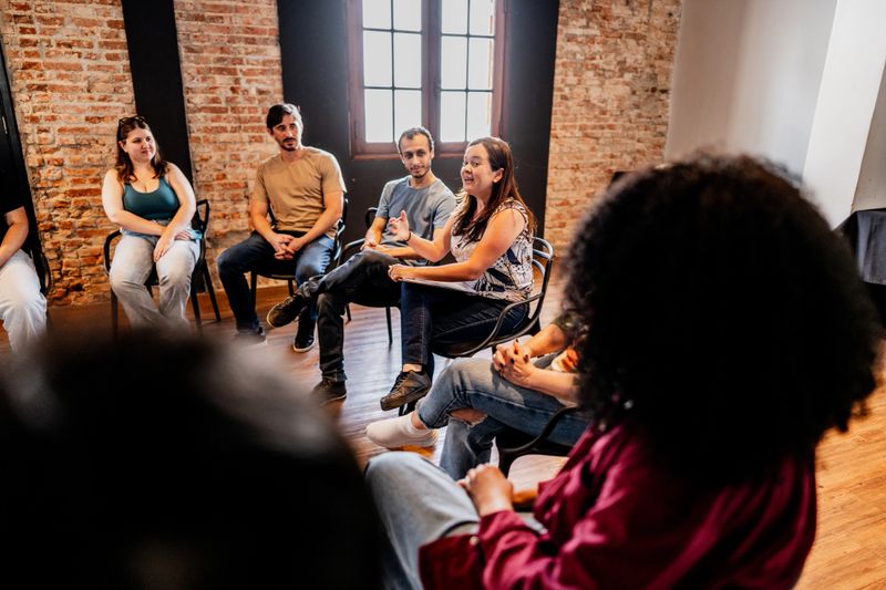 Mental Health Professional talking with participants on a therapy group
