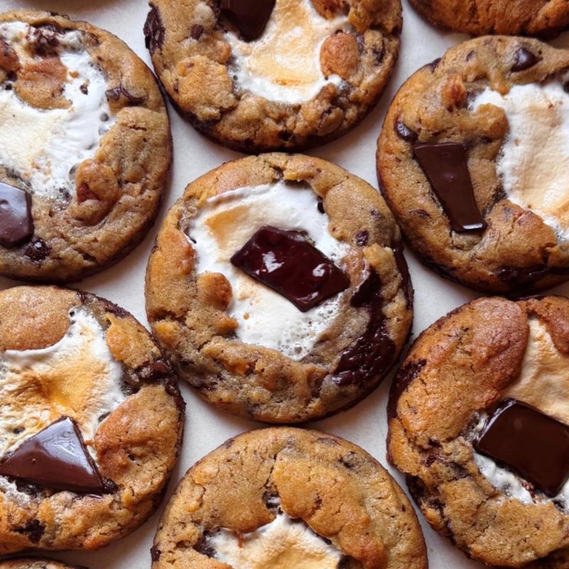 Freshly baked cookies with a golden-brown finish and chocolate chips. Perfectly crisp on the edges with a soft center, offering a delicious, comforting treat for any occasion.