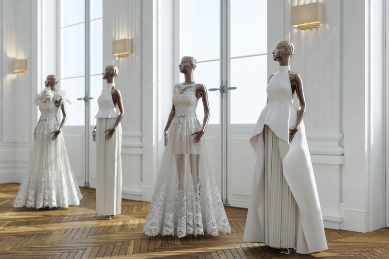 Elegant wedding dresses displayed on mannequins inside a bright and modern bridal boutique. No people, indoor fashion retail setting, luxury bridal fashion concept.
