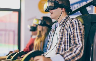People enjoying a virtual reality gaming experience.