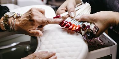 Woman getting a manicure at a nail salon.