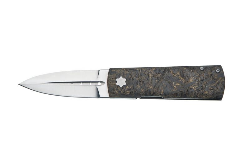 Modern folding dagger with a marbled carbon fiber handle and double-edged blade on white.