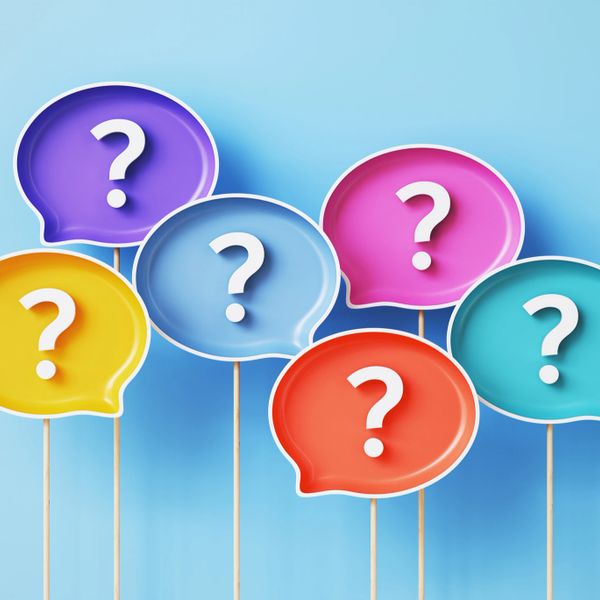Colorful speech bubbles with question marks on a blue background.