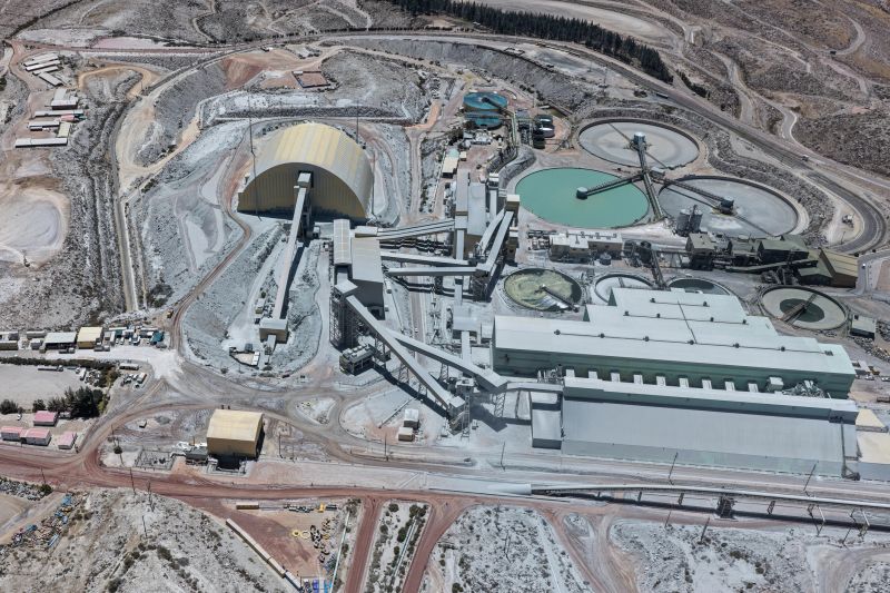 Mineral processing plant next to dome and flotation ponds