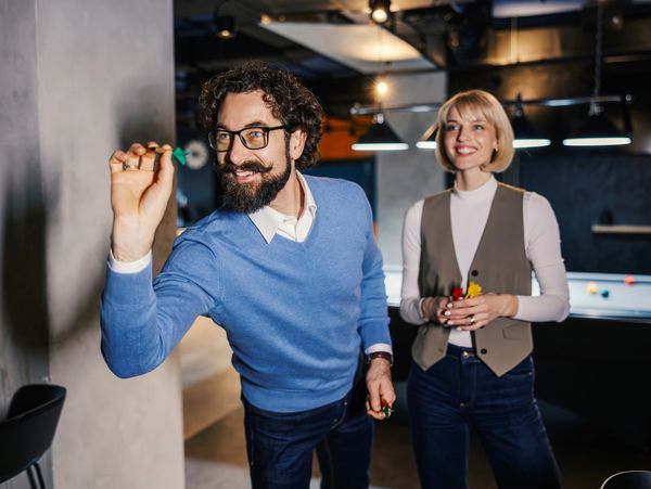 Couple playing darts