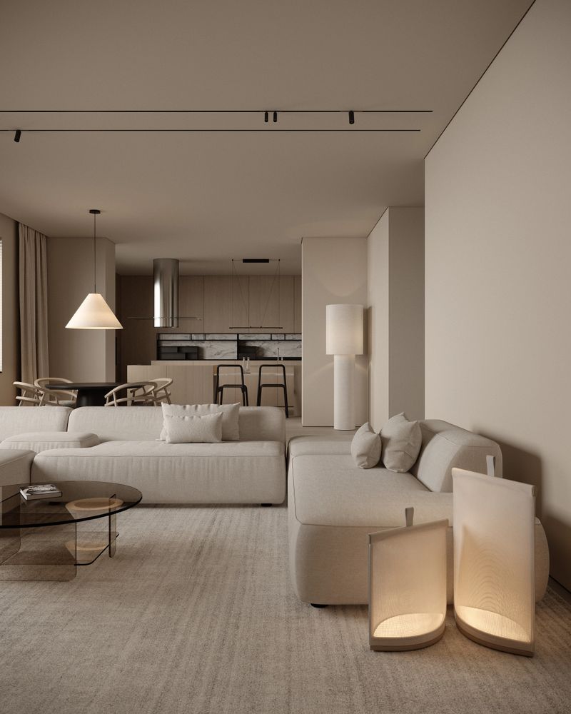 Modern open-plan living room interior in warm neutral tones featuring a minimalist sofa, soft textile textures, and ambient lighting. Contemporary design with clean lines, natural materials, and a seamless connection between the living area, dining space, and kitchen. Elegant, cozy, and bright residential interior ideal for modern lifestyle concepts, home decor inspiration, and luxury apartment visuals.