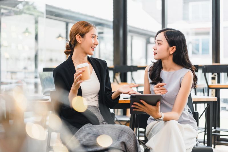 Collaboration of Businesswomen Meeting in Cafe