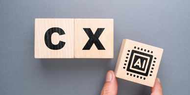 Wooden blocks with CX and AI symbols.