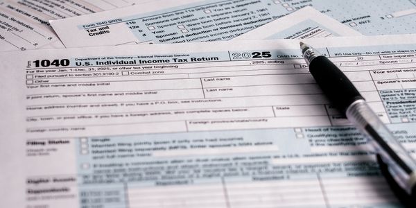 2025 U.S. Individual Income Tax Return form with a pen.