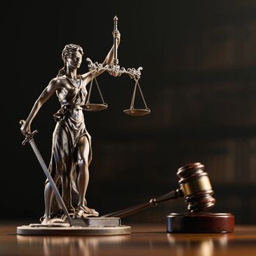 Statue of Lady Justice with scales and gavel.