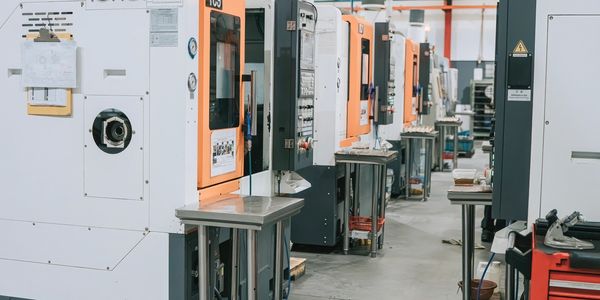 Row of industrial machines in a factory setting.