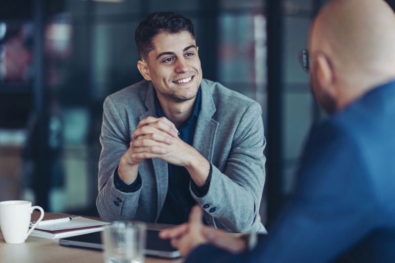 Focus on a young businessman during a meeting