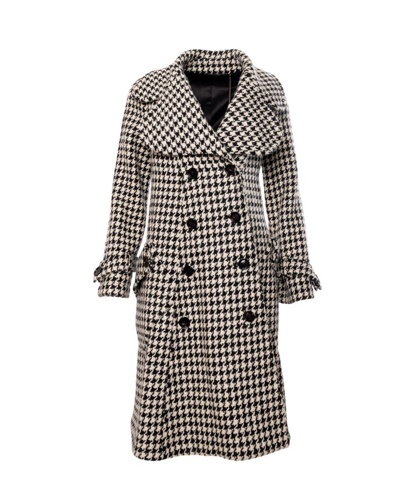 Stylish black and white houndstooth patterned wool overcoat featuring a wide collar, double breasted button closure, long sleeves with cuff details and knee length cut, photographed in studio on a white background, ideal for fashion, winter clothing, luxury outerwear and e commerce use