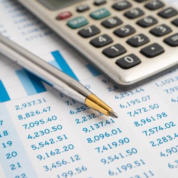 Calculator & Pen on a financial report