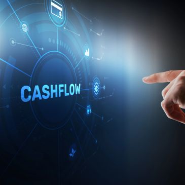Hand pointing at cashflow concept on digital interface.