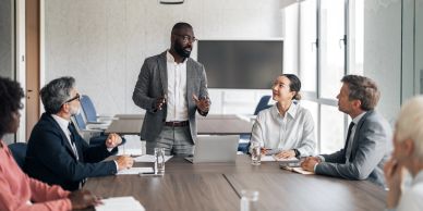 Two women engaged in a friendly business meeting.