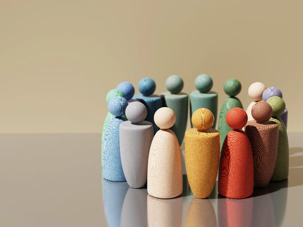 Wooden figurines forming a circle.