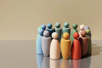 Colorful wooden figures stand in a circle.