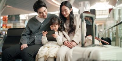 Family enjoying time together at the airport.