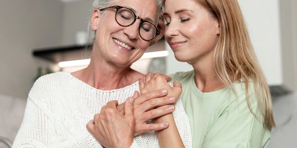 Two women sharing a tender moment.