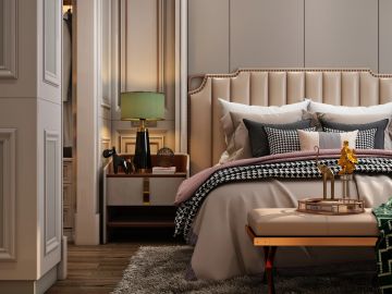 Elegant bedroom with beige tones and stylish decor.