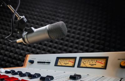 Professional microphone and audio mixer in a recording studio.