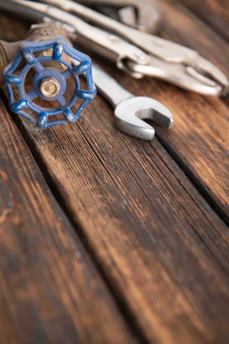 Close-up of hand tools on a rustic wooden table. Concept of manual work, craftsmanship, repair, and construction with copy space.