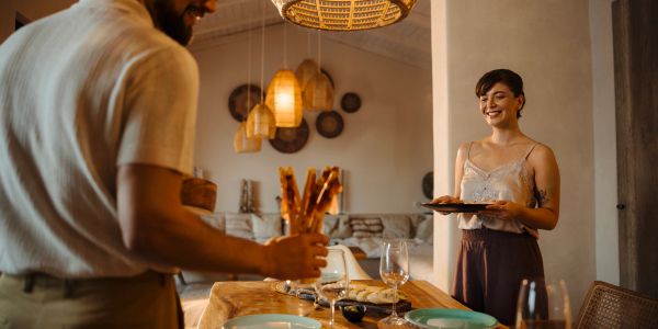 Couple enjoying a private chef catered dinner   in their home.