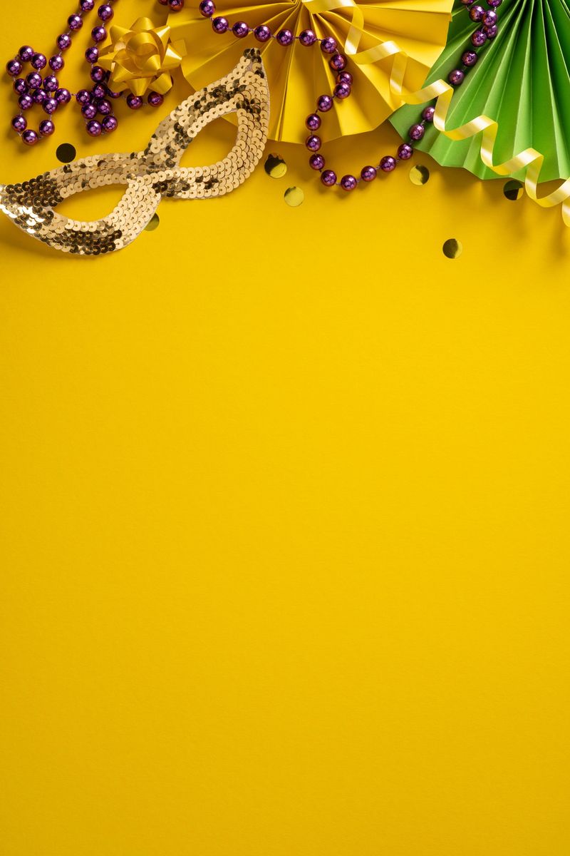 Vibrant vertical Mardi Gras scene features a gold sequined mask, purple beads, and green and yellow paper fans against a sunny backdrop, creating festive mood and decorative ambiance