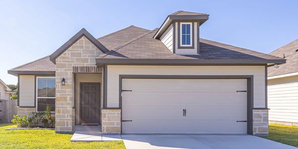 Modern single-story house with garage and front lawn.