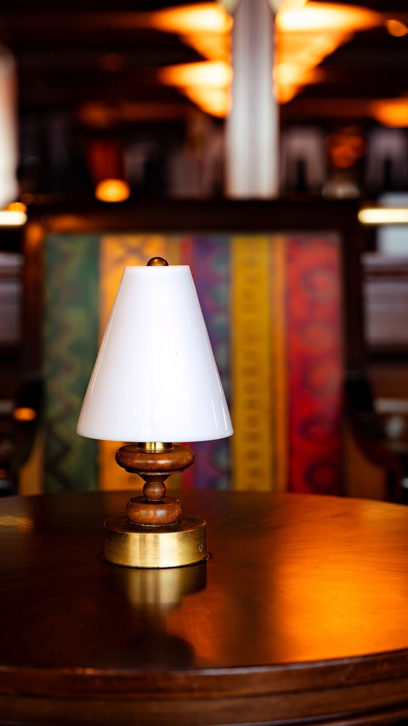 Wooden table lamp illuminating a cozy restaurant or cafe interior