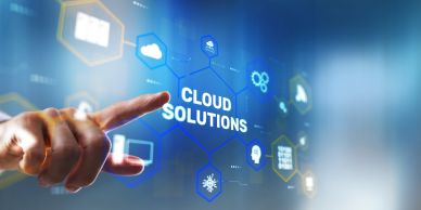 Hand interacting with a digital interface displaying 'Cloud Solutions'.