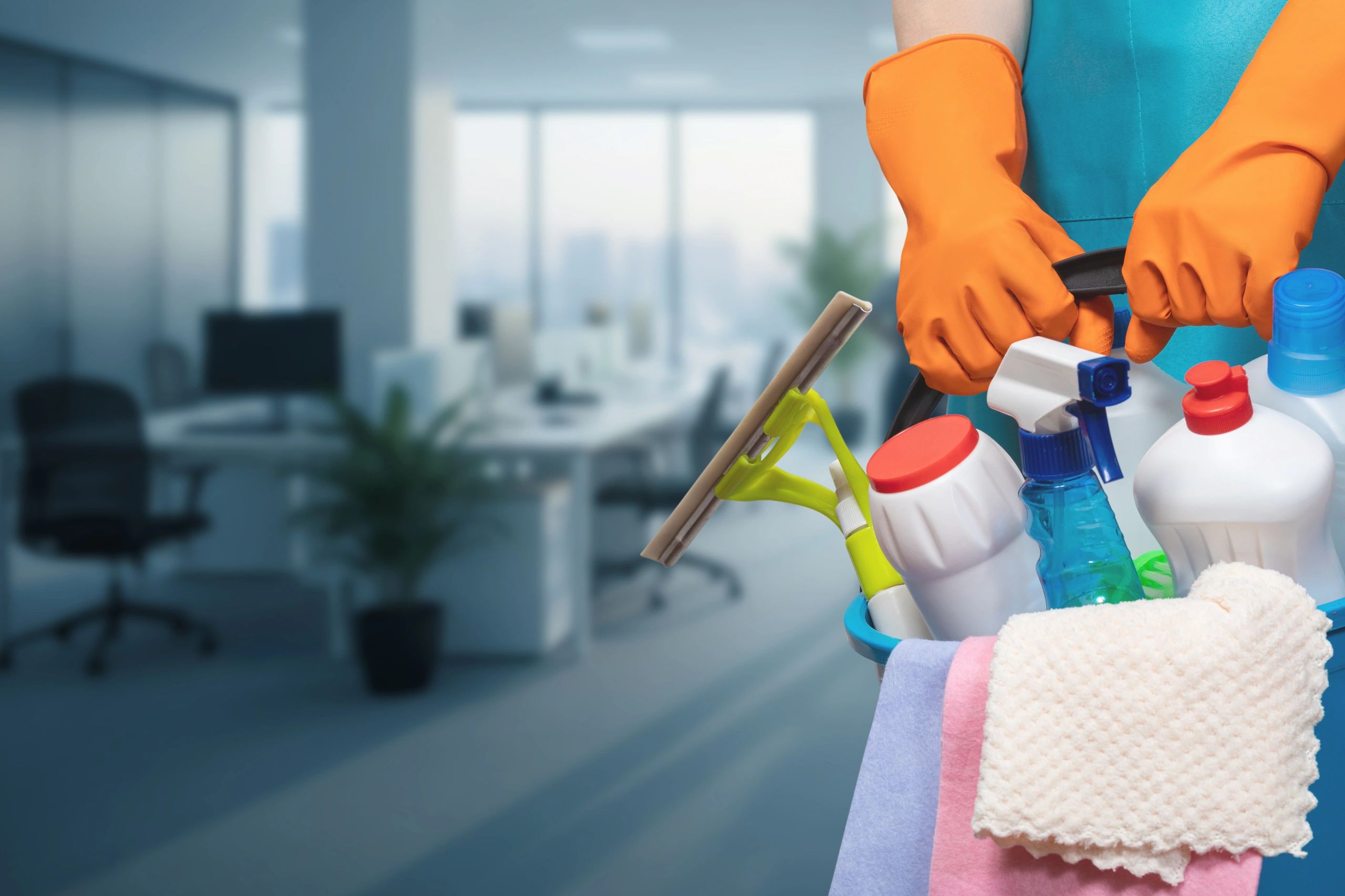 cleaning supplies in the hands of a professional cleaner in an office setting