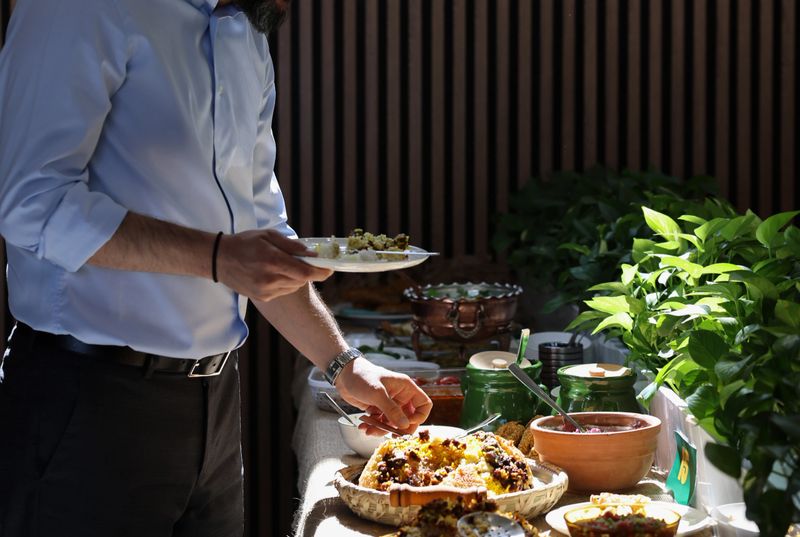 A variety of traditional Iranian dishes displayed on a dining table. Persian cuisine is known for its balance of flavors, fresh ingredients, and cultural significance in Iranian daily life.